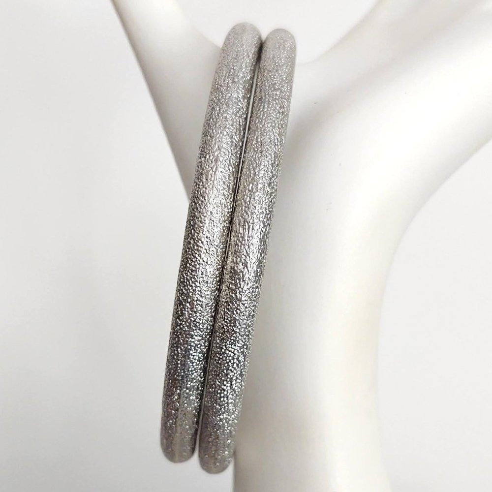 Weighty textured silver bangles
